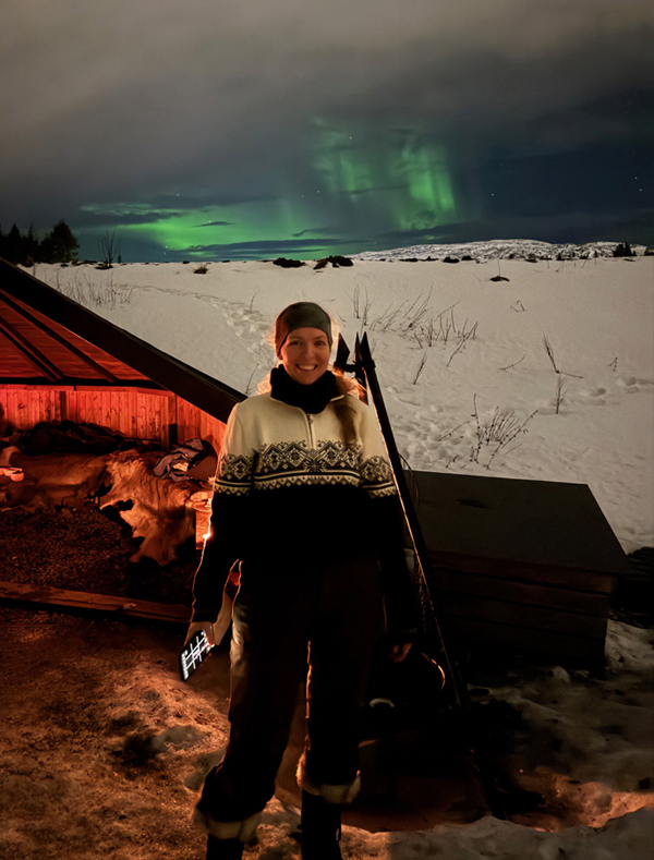 Lauren Kate standing under the northern lights in Alta, Norway