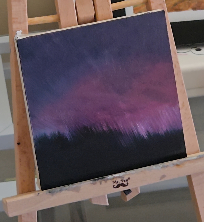 in progress painting of northern lights. shown is beginnings of magenta clouds and black trees with dark sky.